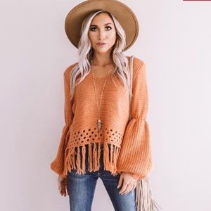 Rust knit sweater with fringe